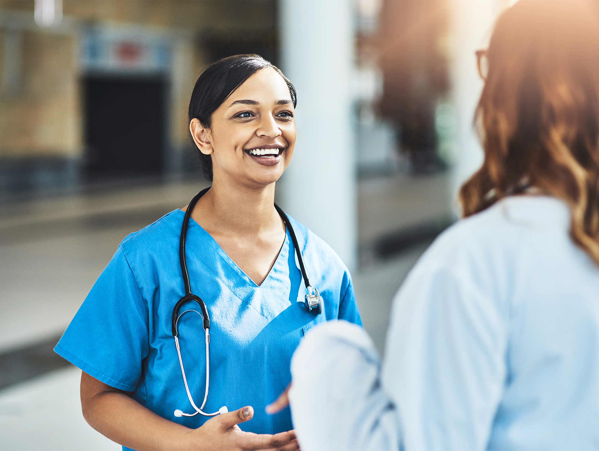 Doctor talking to woman