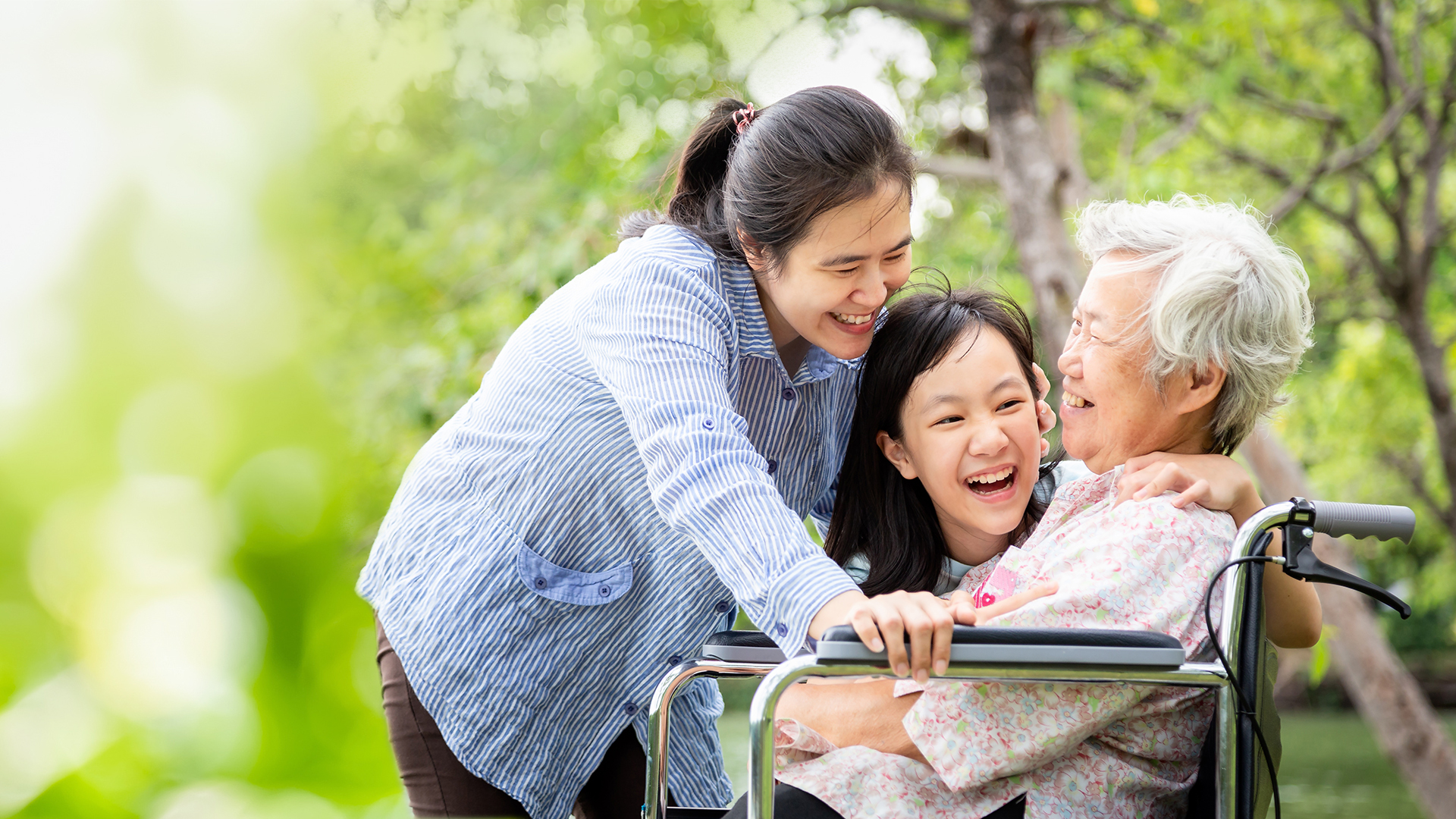 Three generations of women smiling